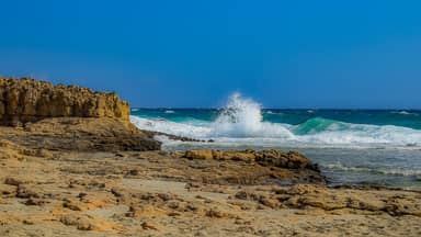 rocky coast wave smashing sea  